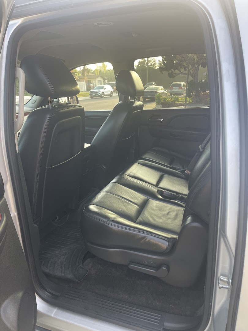 Clean Vibes interior detail — black leather rear seats of SUV after full interior cleaning