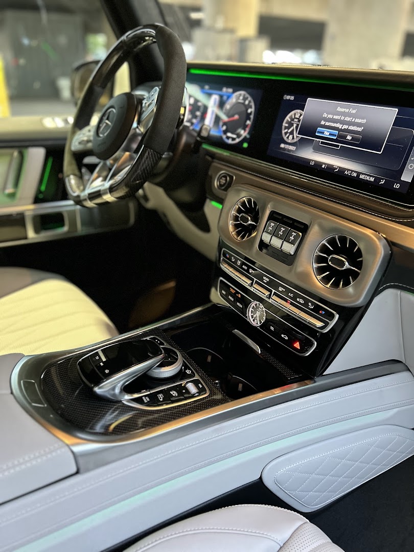 Clean Vibes detail work — luxury Mercedes G-Wagon interior with green ambient lighting after full interior detail