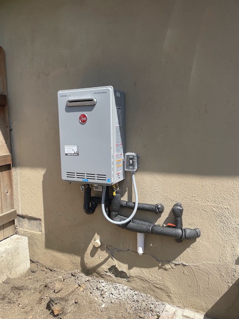 Rheem outdoor tankless unit on stucco exterior