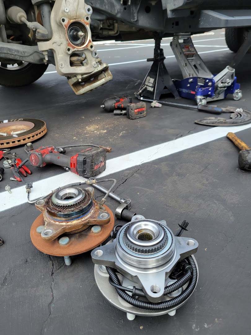 Mobile auto service work — vehicle repair in driveway