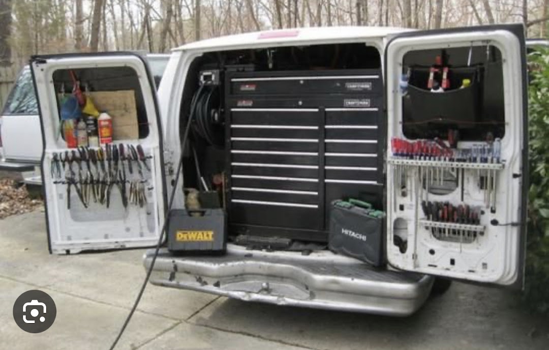 Mechanic performing on-site vehicle service