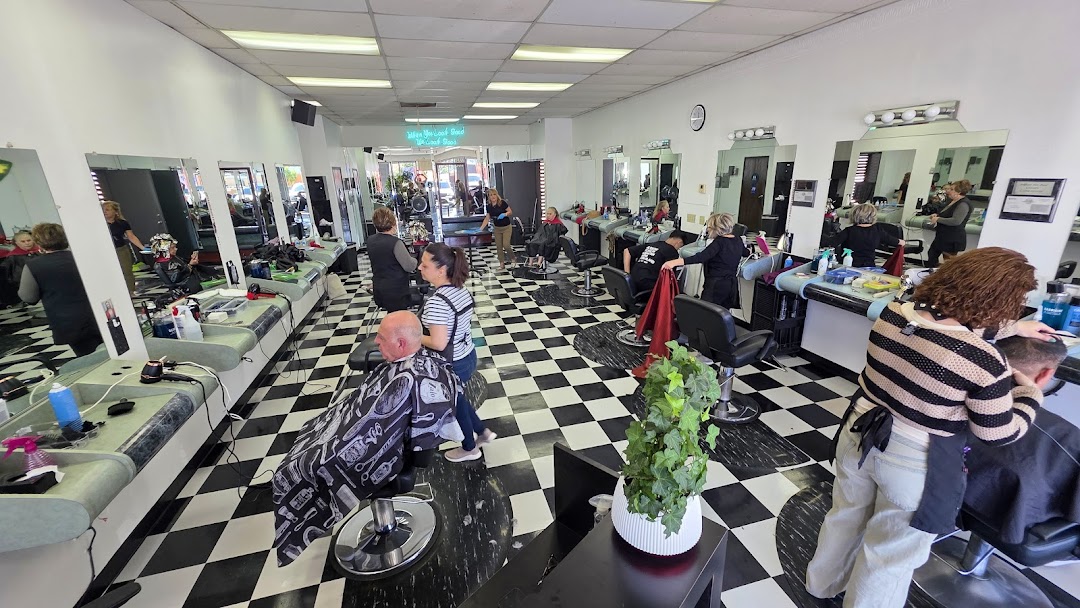 Inside New Image Cuts salon in Glendale — stylists at work with clients